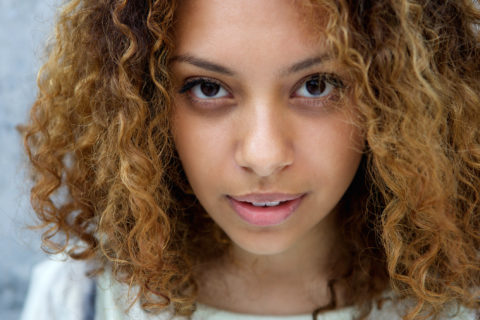 Close up portrait of a beautiful young woman with serious expression