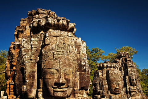 Faces Bayon Temple with a blue sky, Angkor Thom, Angkor Wat, Cambodia, Southeast Asia